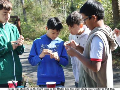 Rocky Run 7th grade science students on the MWEE Field Trip test the water from Cub Run